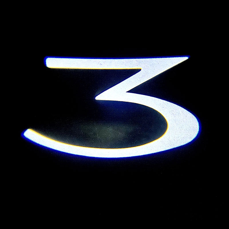 Dørlys med logo 2 stk for Model 3 (2018-08.2023)